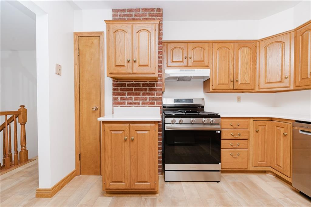 96 McHenry Road Indiana, PA 15701 - Photo 9 of 34 a kitchen with stainless steel appliances granite countertop a stove top oven and cabinets