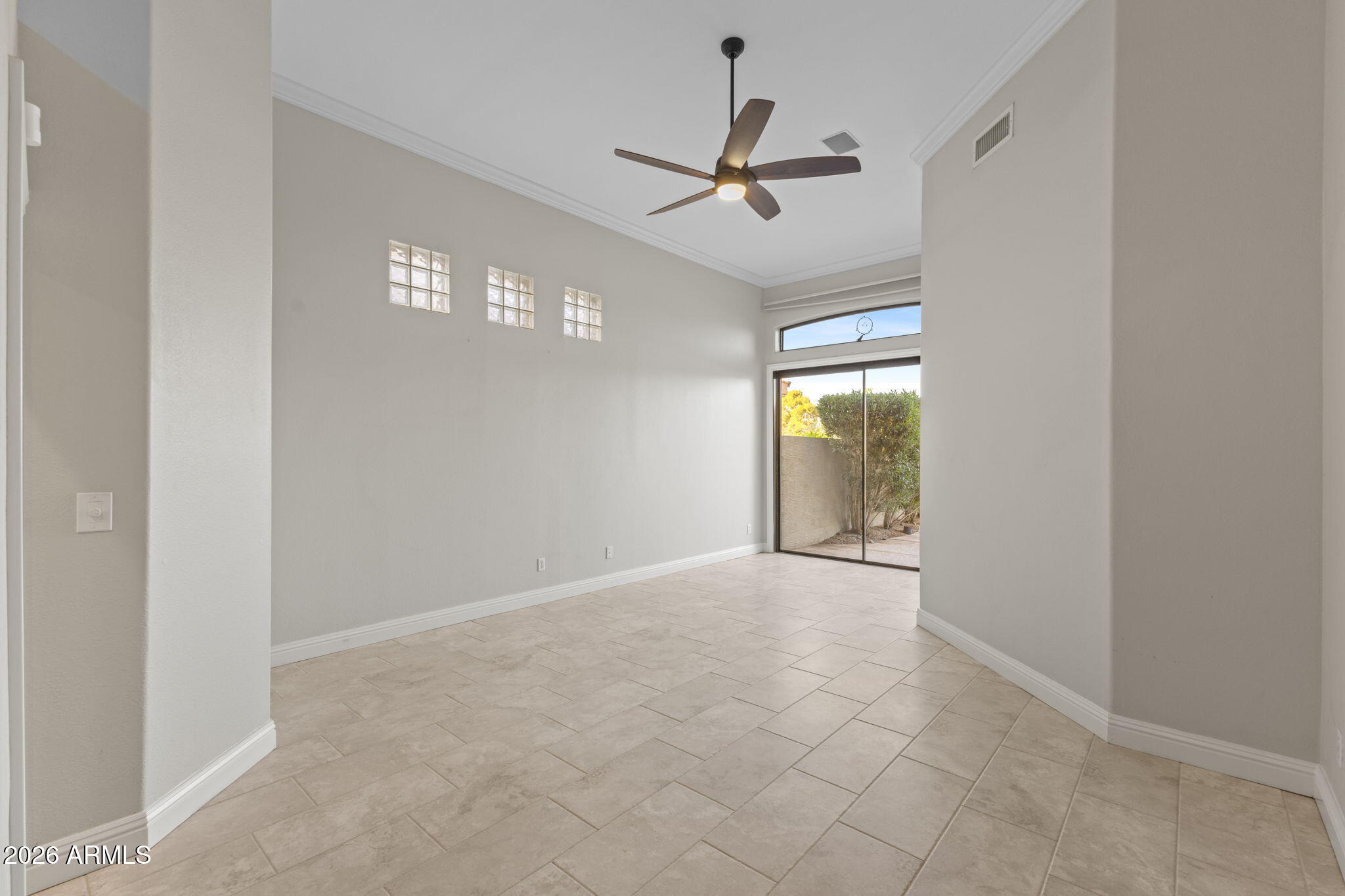 8100 East Camelback Road, Unit 43 Scottsdale, AZ 85251 - Photo 17 of 52 a view of a livingroom with a ceiling fan and window