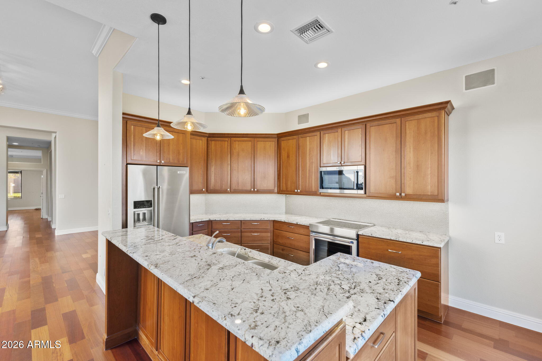 8100 East Camelback Road, Unit 43 Scottsdale, AZ 85251 - Photo 24 of 52 a kitchen with granite countertop a sink a counter space appliances and cabinets