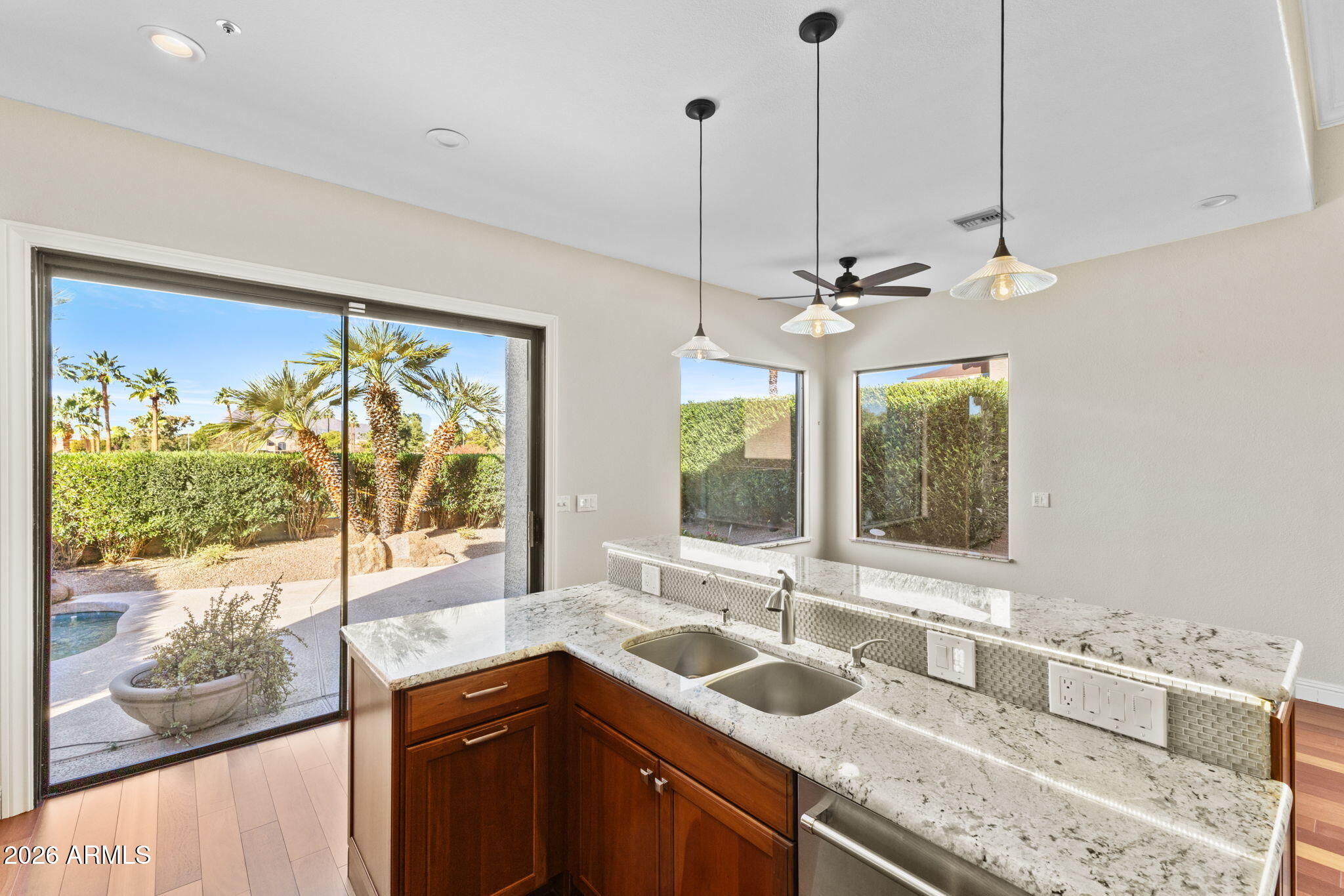 8100 East Camelback Road, Unit 43 Scottsdale, AZ 85251 - Photo 25 of 52 a kitchen with a sink window and cabinets