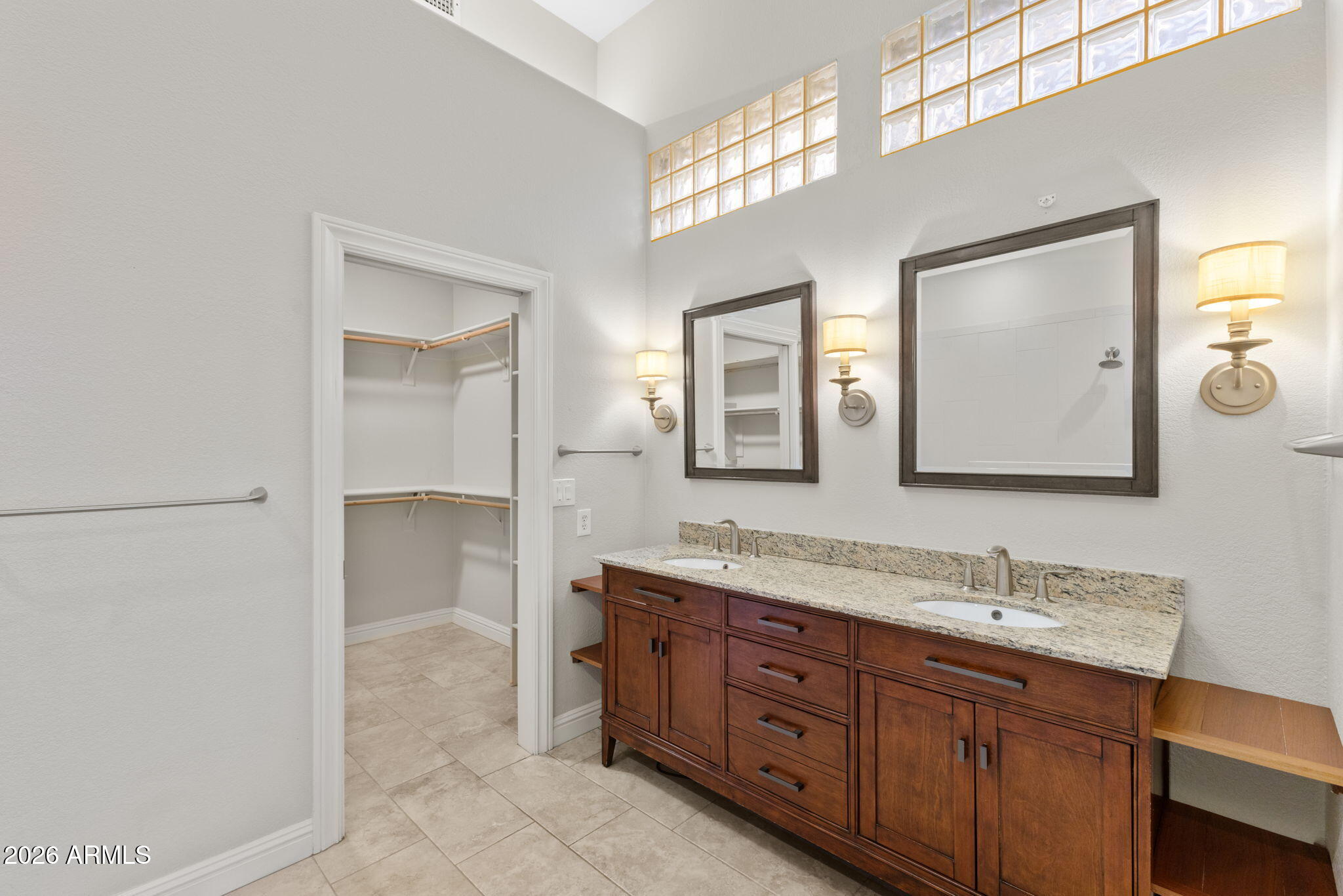 8100 East Camelback Road, Unit 43 Scottsdale, AZ 85251 - Photo 28 of 52 a bathroom with a granite countertop sink mirror and double