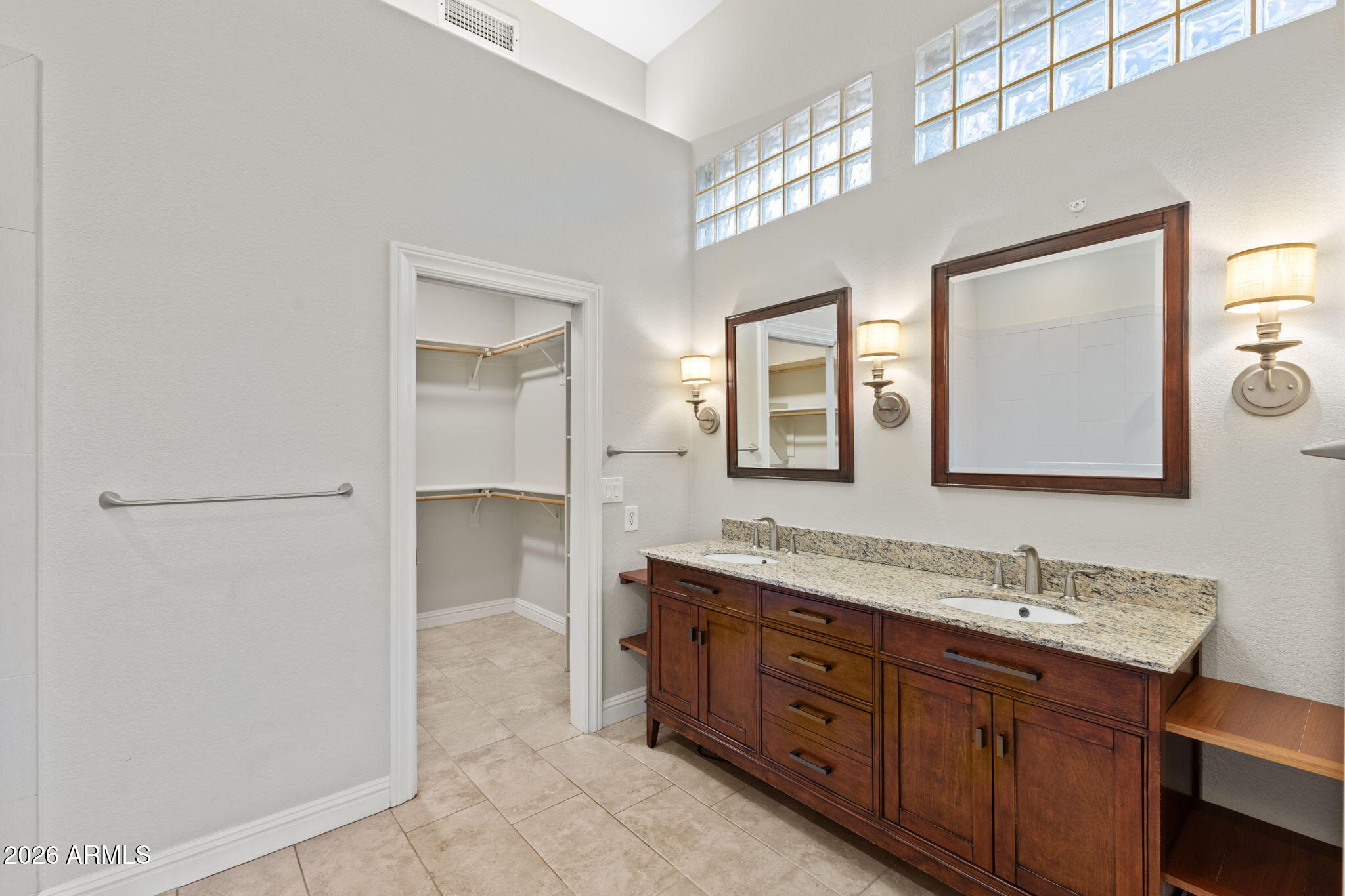 8100 East Camelback Road, Unit 43 Scottsdale, AZ 85251 - Photo 29 of 52 a spacious bathroom with a double vanity sink and a mirror