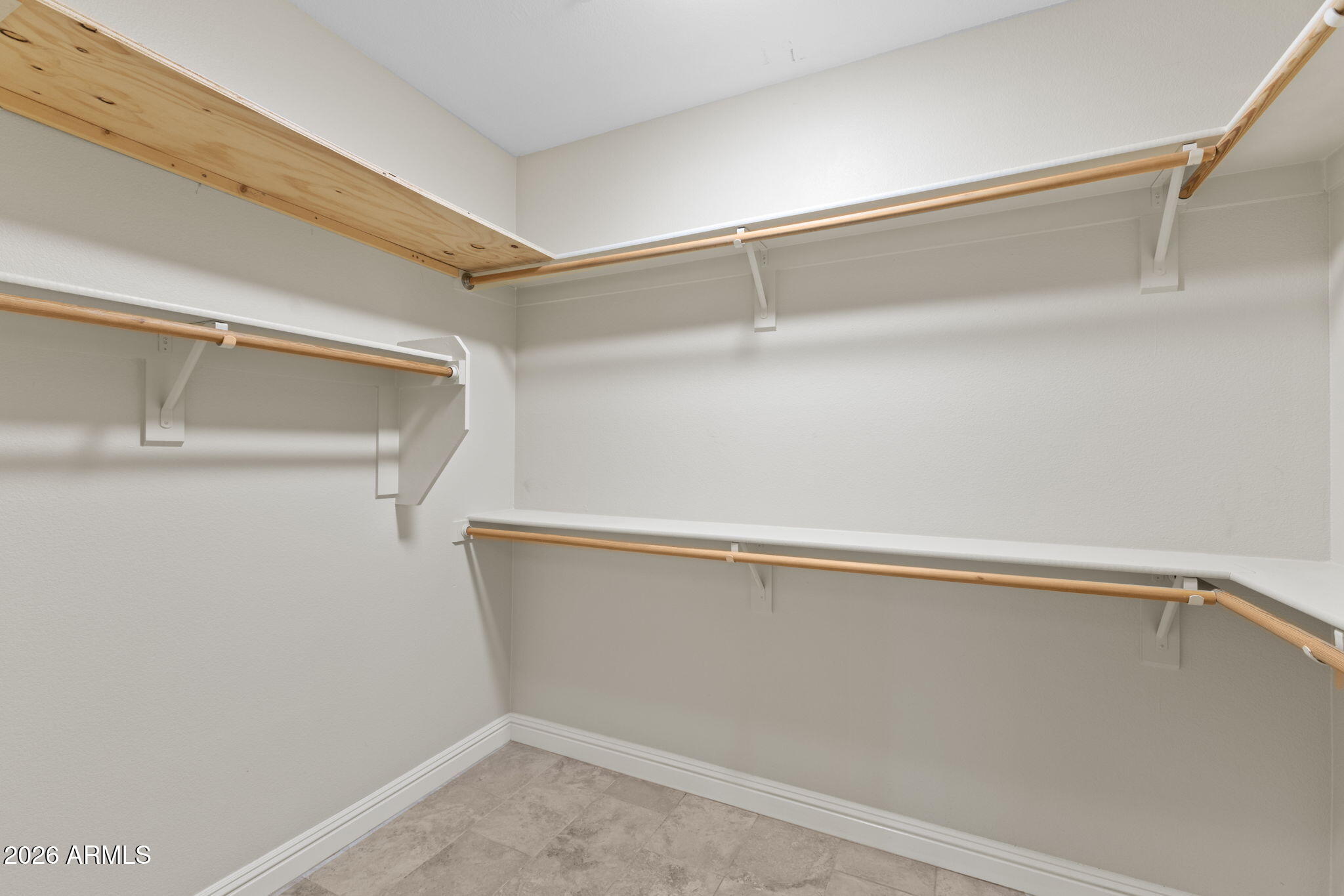 8100 East Camelback Road, Unit 43 Scottsdale, AZ 85251 - Photo 31 of 52 a view of an empty walk in closet