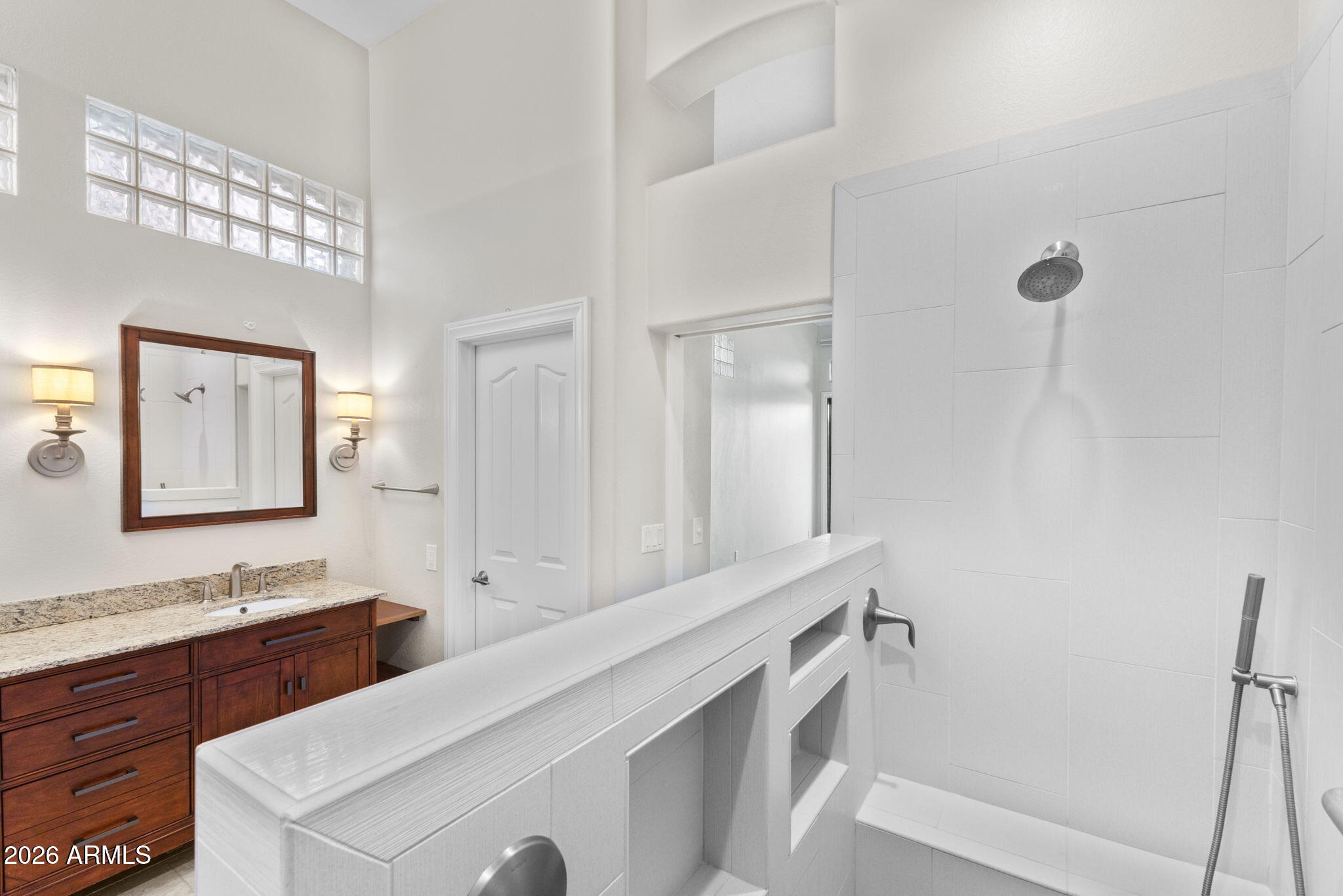 8100 East Camelback Road, Unit 43 Scottsdale, AZ 85251 - Photo 32 of 52 a bathroom with a sink and a mirror