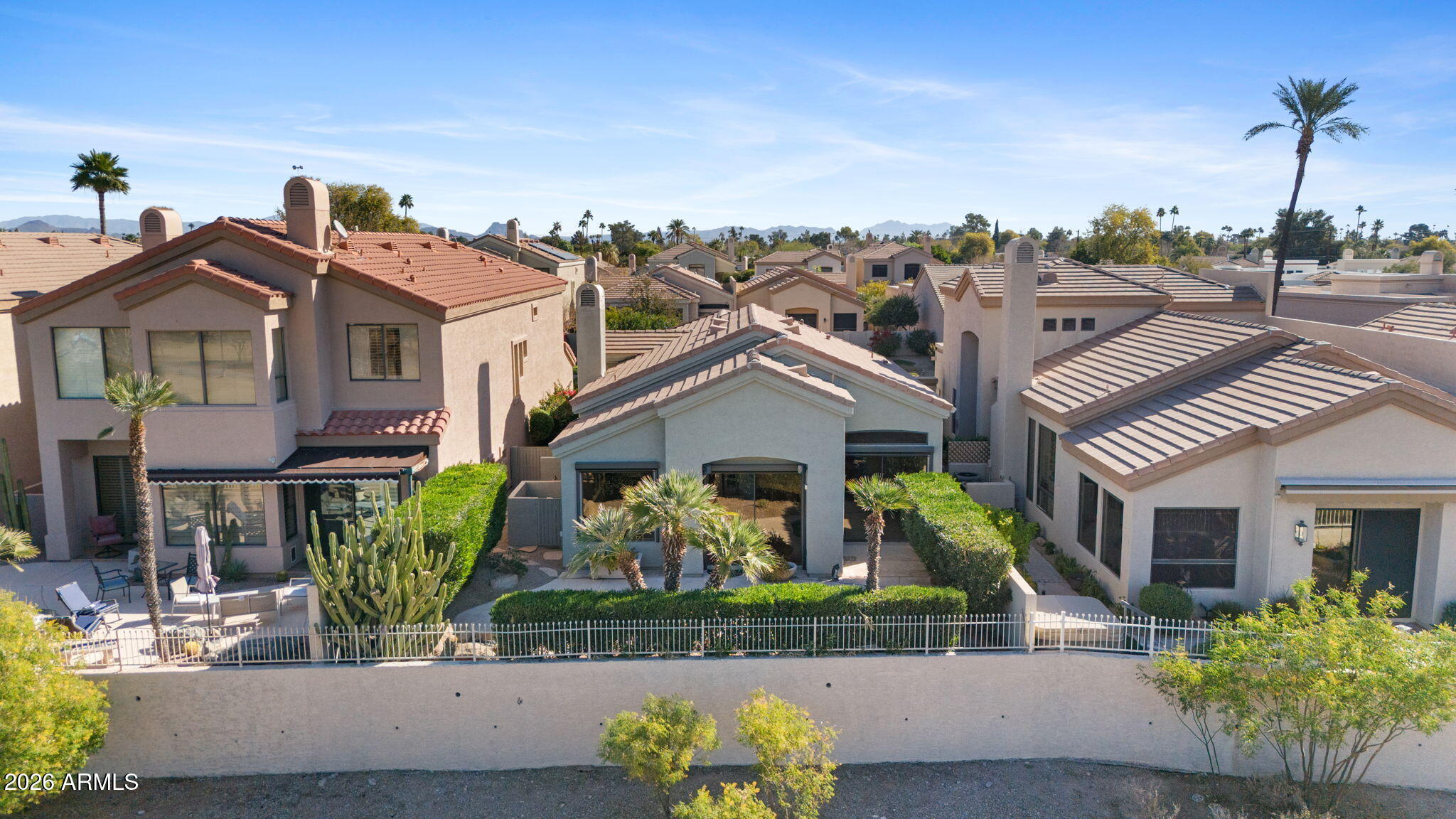 8100 East Camelback Road, Unit 43 Scottsdale, AZ 85251 - Photo 48 of 52 a front view of a house with a garden