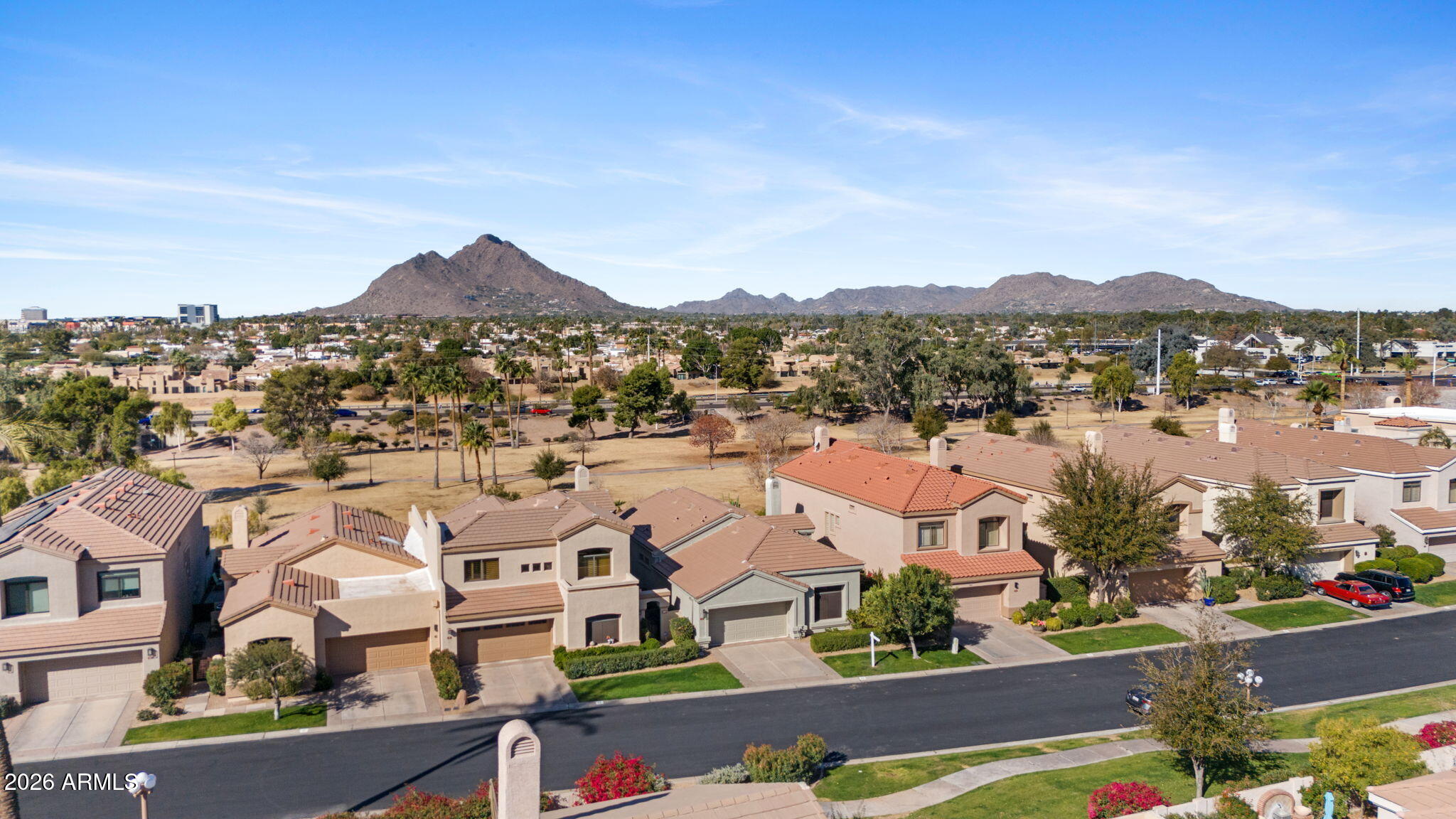 8100 East Camelback Road, Unit 43 Scottsdale, AZ 85251 - Photo 50 of 52 an aerial view of residential houses with outdoor space and parking