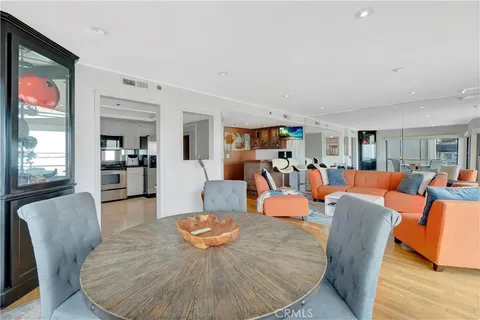 a living room with furniture fireplace and a large window