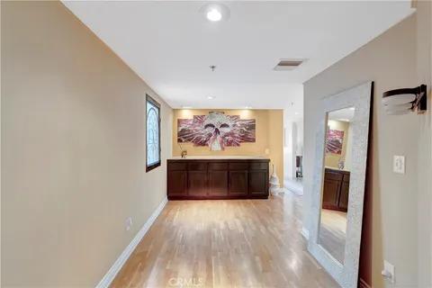 a view of livingroom with hardwood floor and hallway