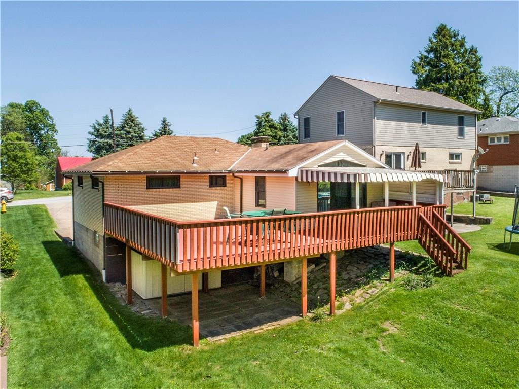 41 Flora Road Pittsburgh, PA 15227 - Photo 3 of 25 The back of the home is wrapped with a party-sized deck w/ patio below!