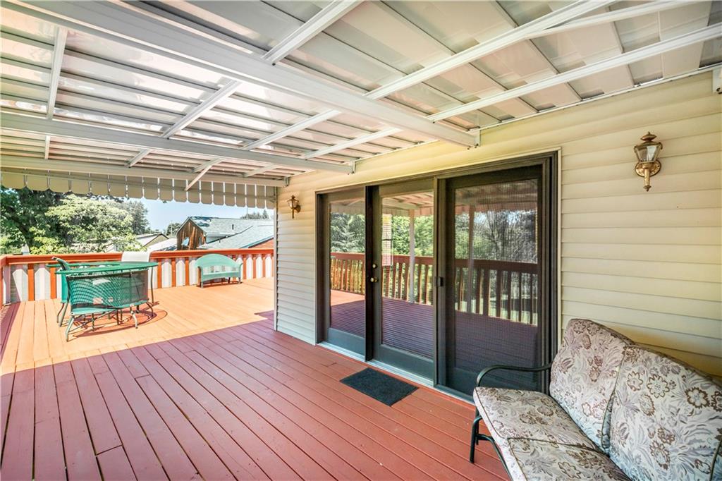 41 Flora Road Pittsburgh, PA 15227 - Photo 21 of 25 Need an escape from the summer sun? Unwind under the covered portion of the deck!