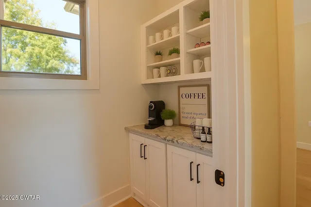 a view of a bathroom with a sink and a window