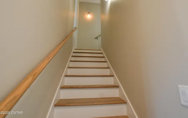 a bedroom with a bed a couch and a window