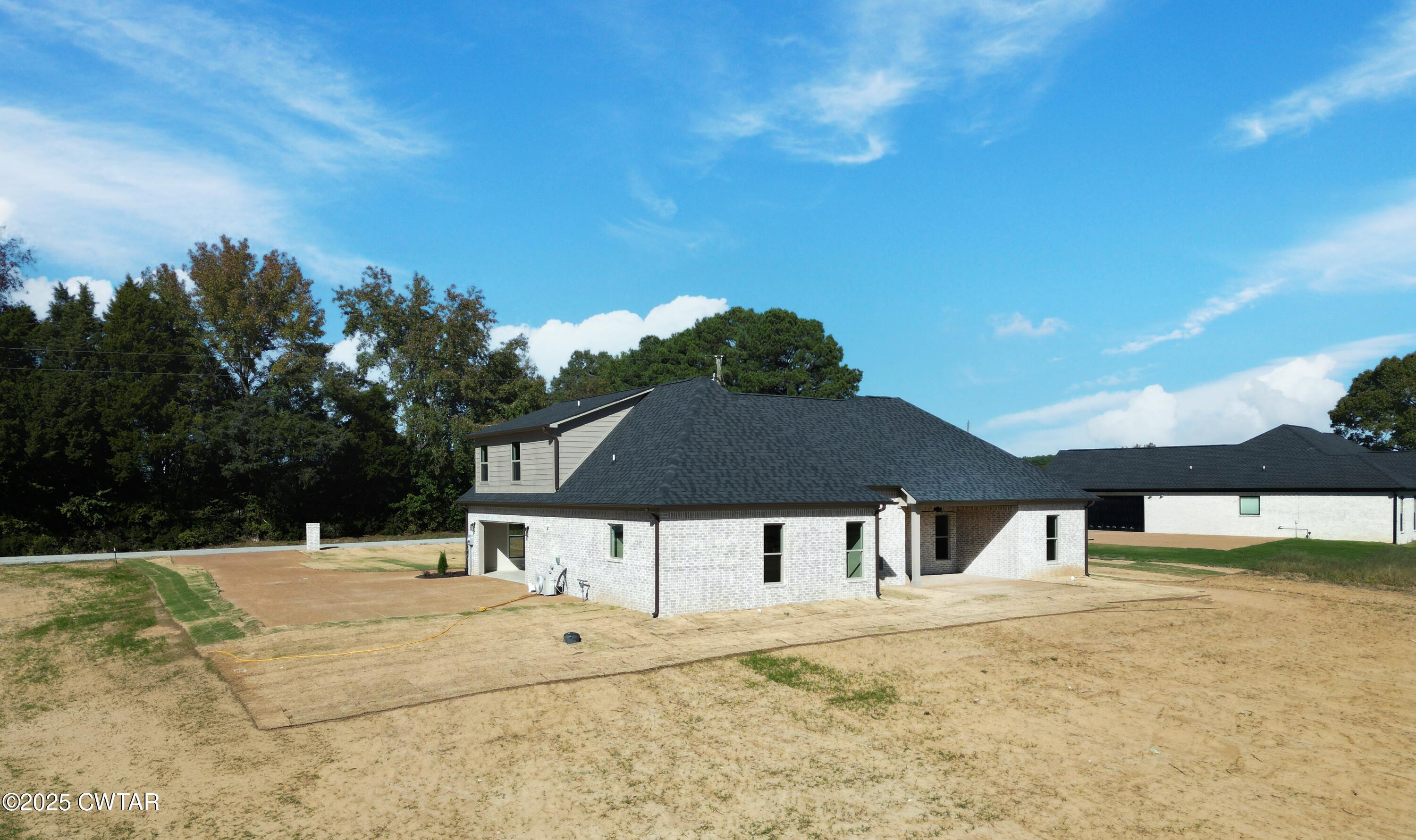 297 Marlow Cemetery Road Gadsden, TN 38337 - Photo 4 of 28 a front view of a house with a yard
