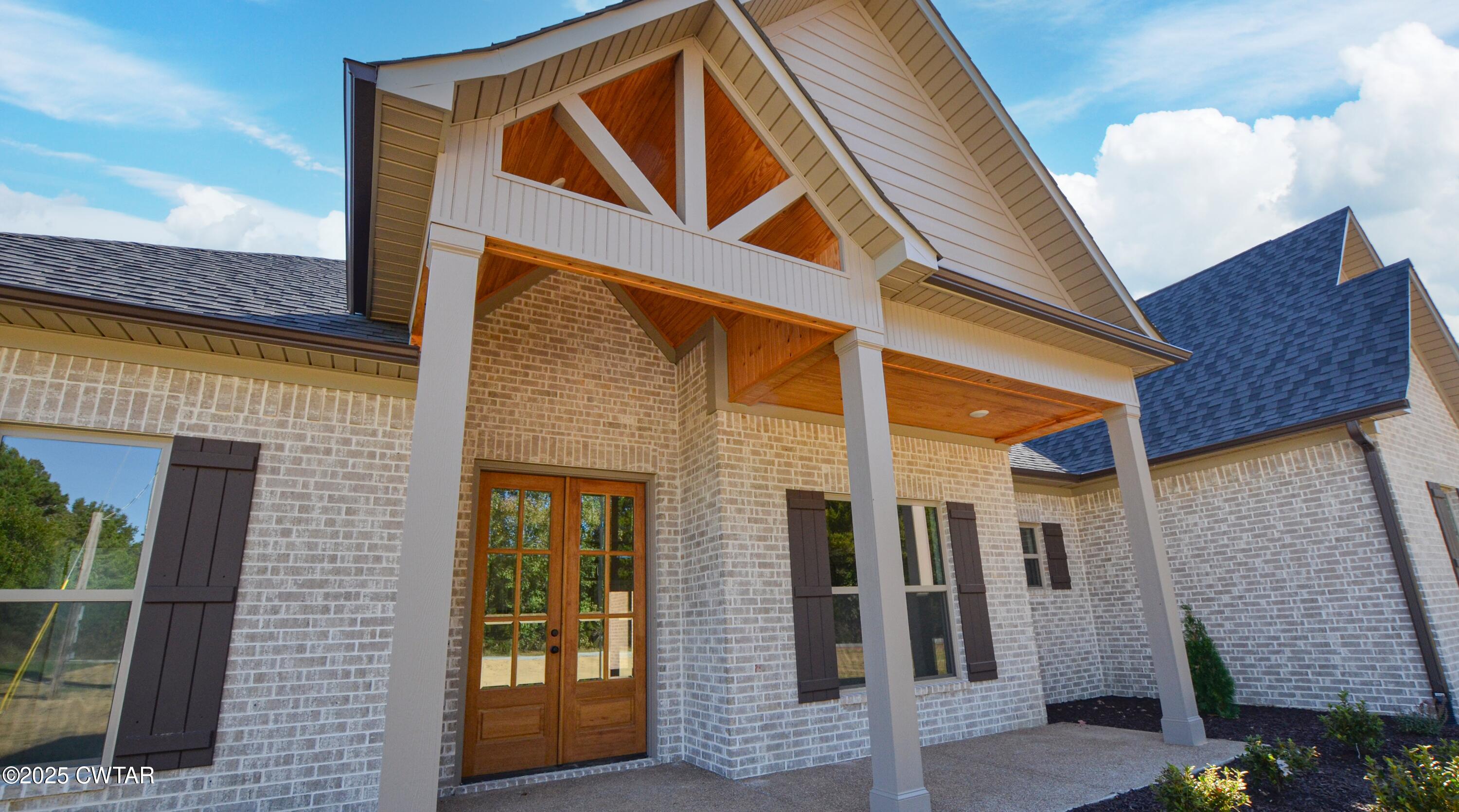 297 Marlow Cemetery Road Gadsden, TN 38337 - Photo 6 of 28 a front view of a house with glass windows