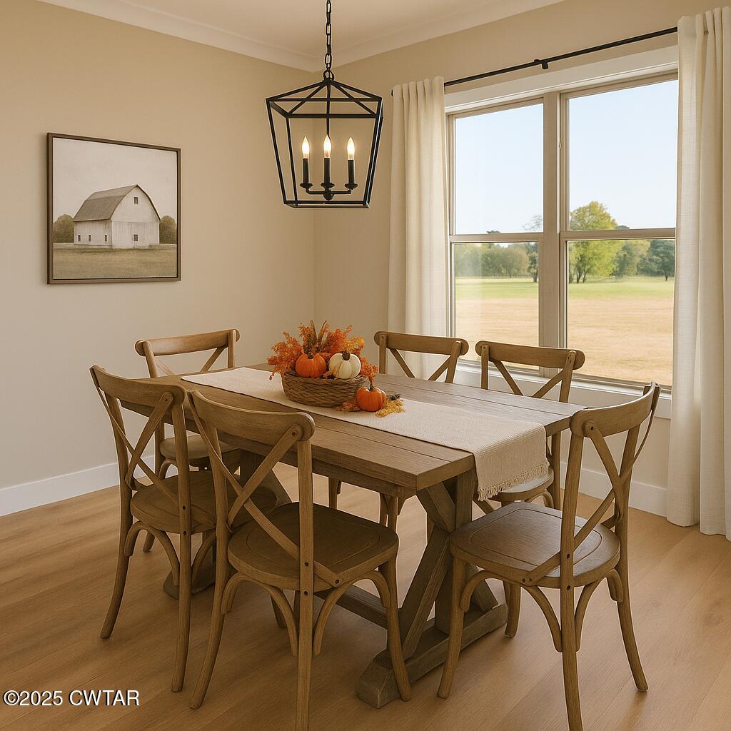 297 Marlow Cemetery Road Gadsden, TN 38337 - Photo 10 of 28 a view of a dining room with furniture large window and wooden floor