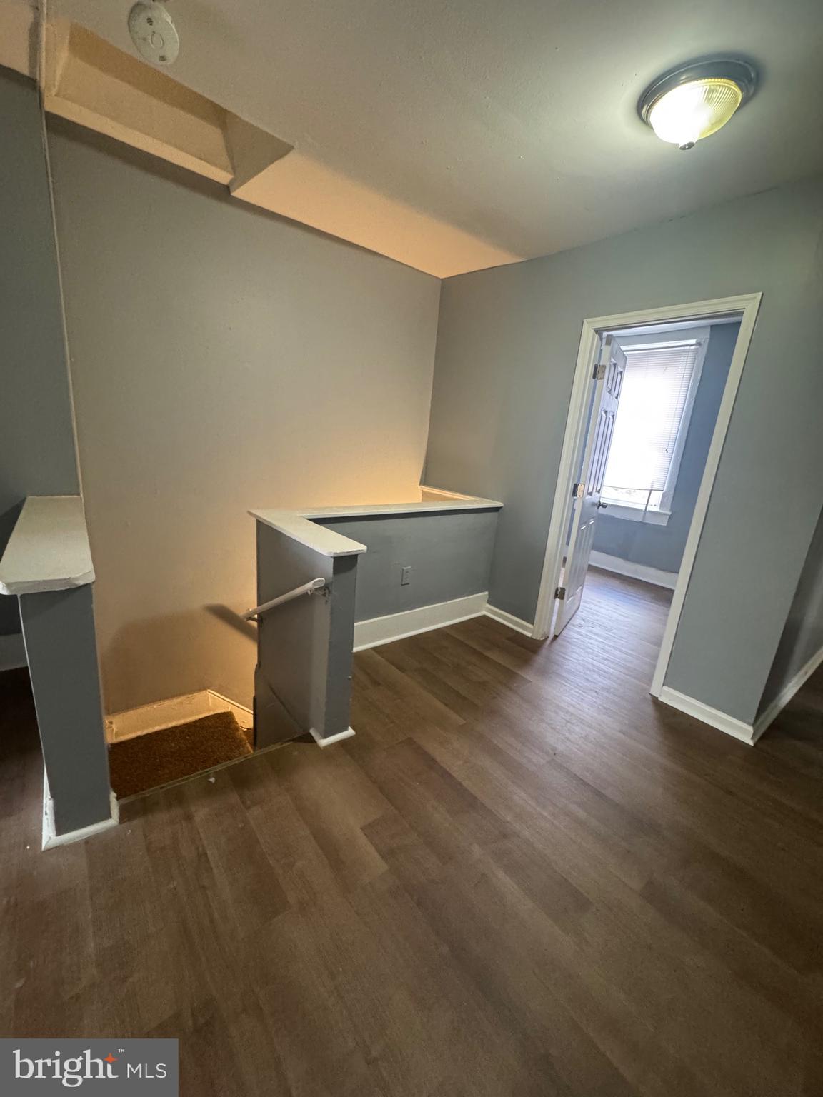 5000 Litchfield Avenue, Unit 2 Baltimore, MD 21215 - Photo 17 of 21 a room with wooden floor and furniture