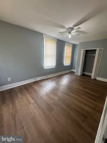 a view of an empty room and a fireplace