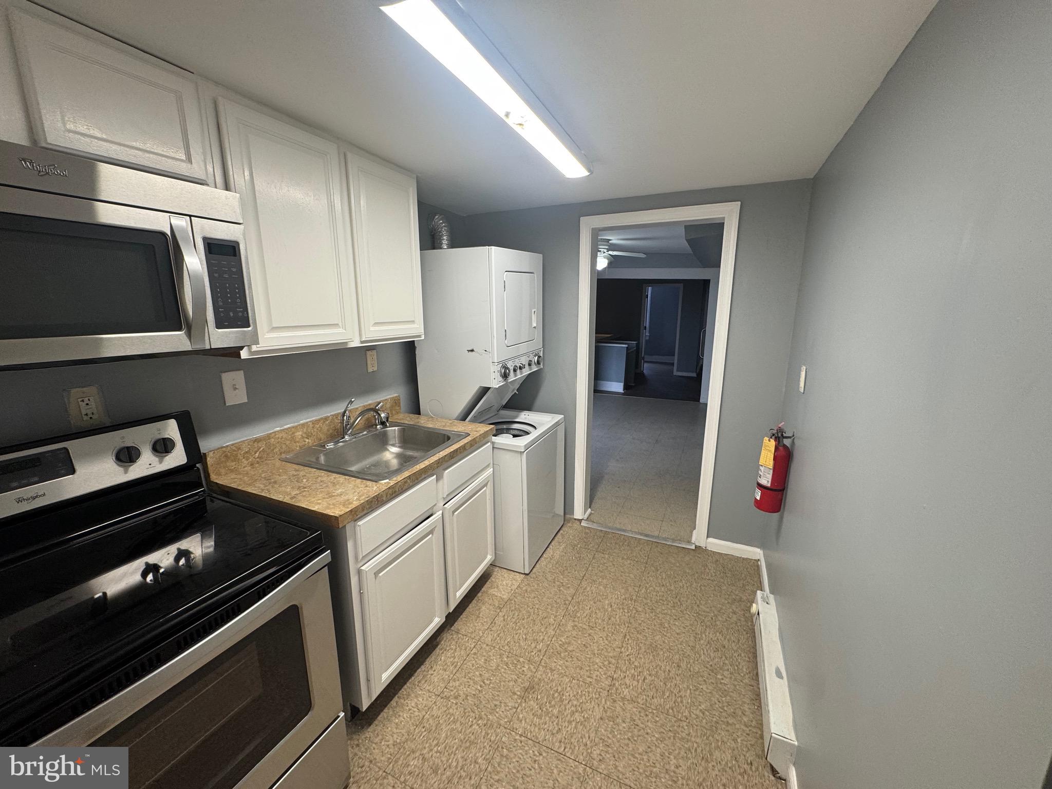 5000 Litchfield Avenue, Unit 2 Baltimore, MD 21215 - Photo 21 of 21 a kitchen with a stove and a microwave