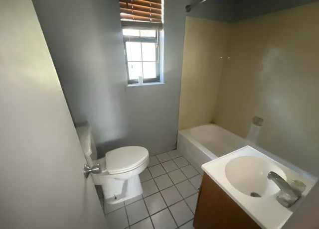 a bathroom with a sink and toilet