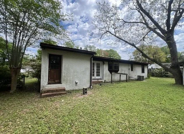 a backyard of a house with lots of green space