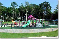 215 Seminole Trail Crestview, FL 32536 - Photo 15 of 20 a childrens park with lots of swings and slides