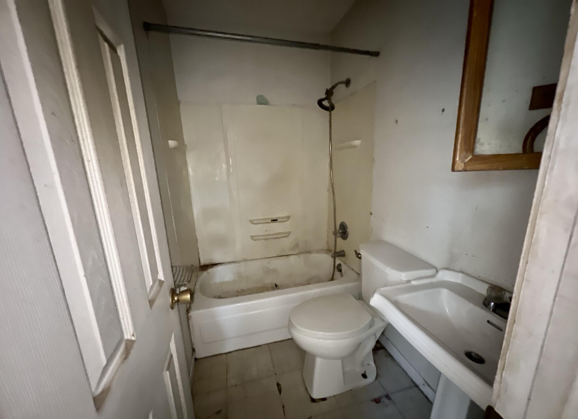 215 Seminole Trail Crestview, FL 32536 - Photo 6 of 20 a bathroom with a sink a toilet and shower