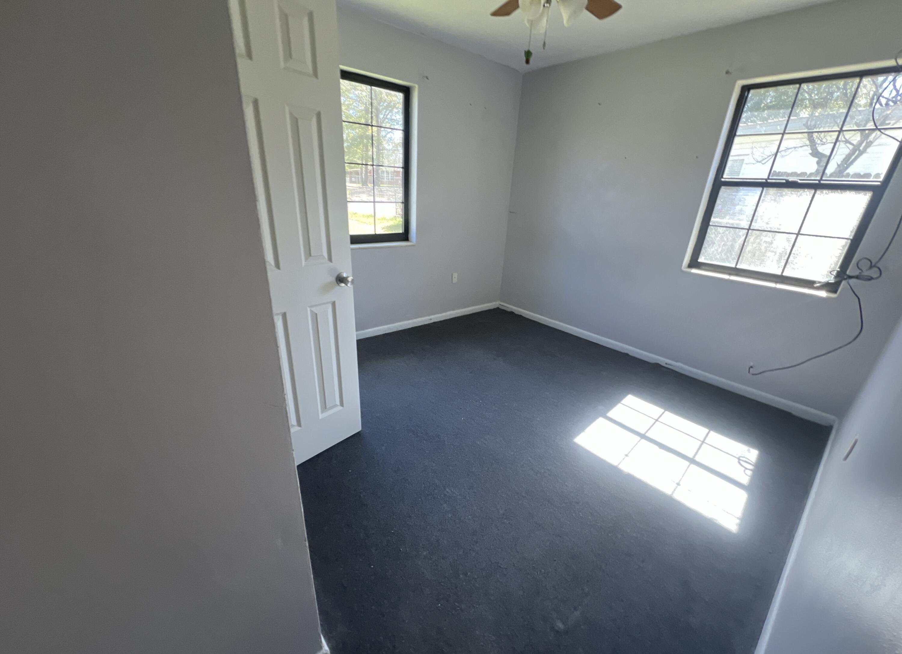 215 Seminole Trail Crestview, FL 32536 - Photo 9 of 20 an empty room with windows and closet