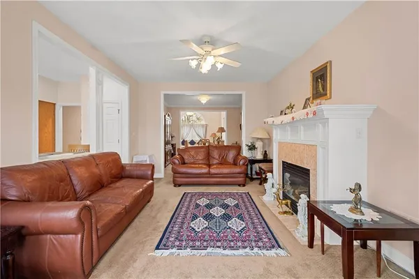 a spacious bedroom with a bed and wooden floor