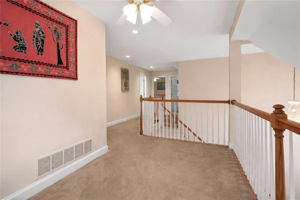 a view of a hallway with staircase