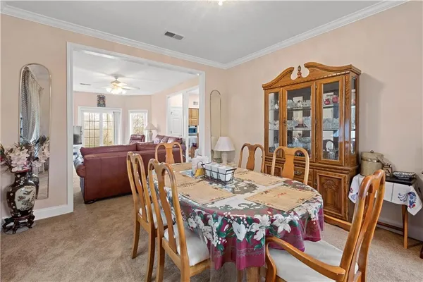 a dining room with furniture and window