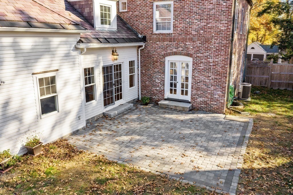 12 Ross Road Belmont, MA 02478 - Photo 29 of 33 a view of a brick house with many windows