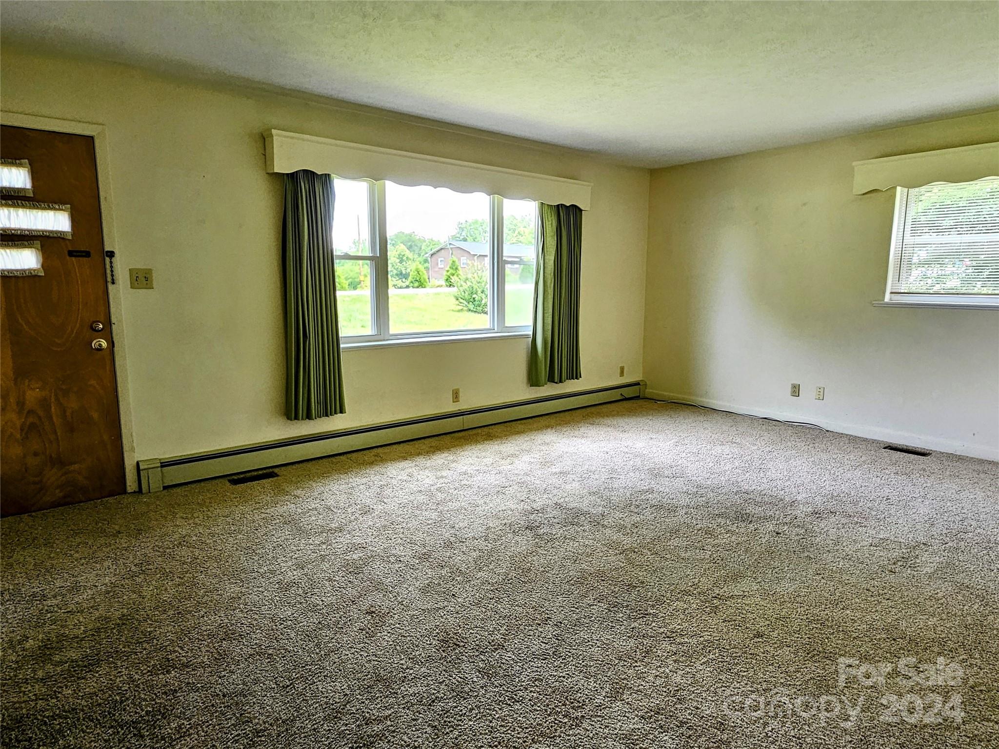 1260 Bethel Road Morganton, NC 28655 - Photo 6 of 13 an empty room with windows
