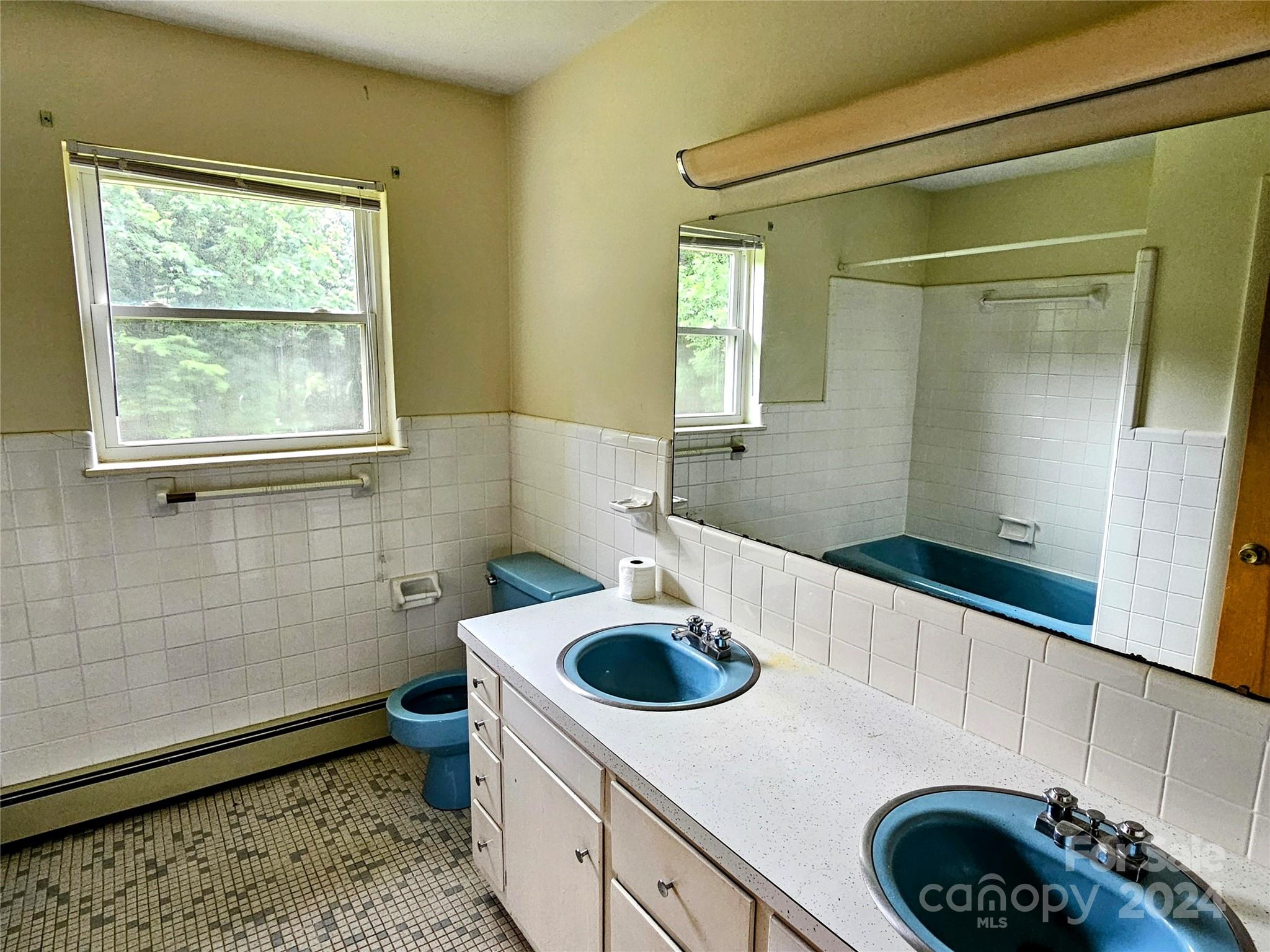 1260 Bethel Road Morganton, NC 28655 - Photo 8 of 13 a bathroom with a sink a toilet and a shower