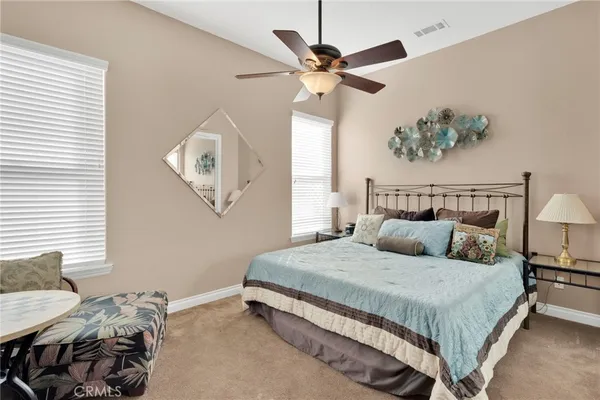 a bedroom with bed and window