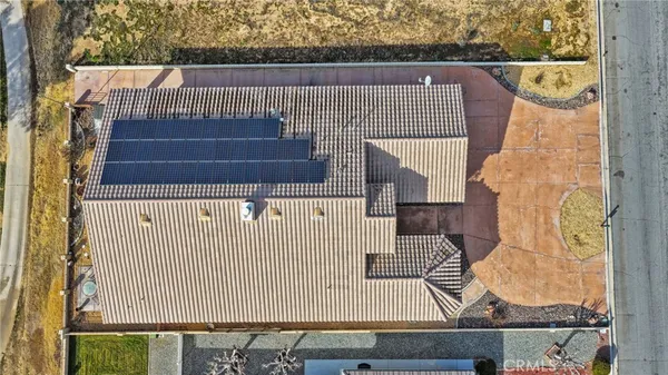 an aerial view of a house with a ocean view