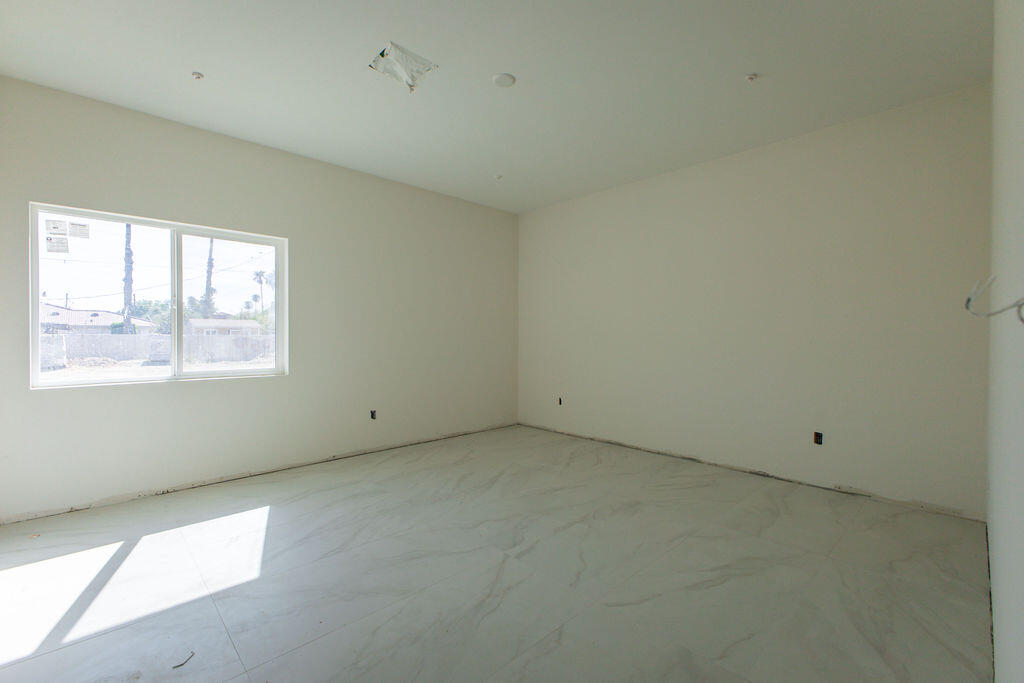 68855 Ortega Road Cathedral City, CA 92234 - Photo 12 of 19 an empty room with a window