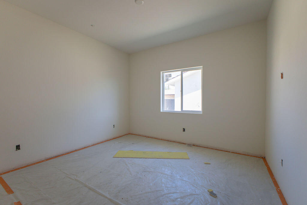 68855 Ortega Road Cathedral City, CA 92234 - Photo 16 of 19 an empty room with a window