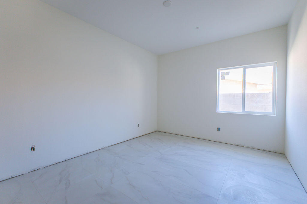 68855 Ortega Road Cathedral City, CA 92234 - Photo 62 of 62 an empty room with a window