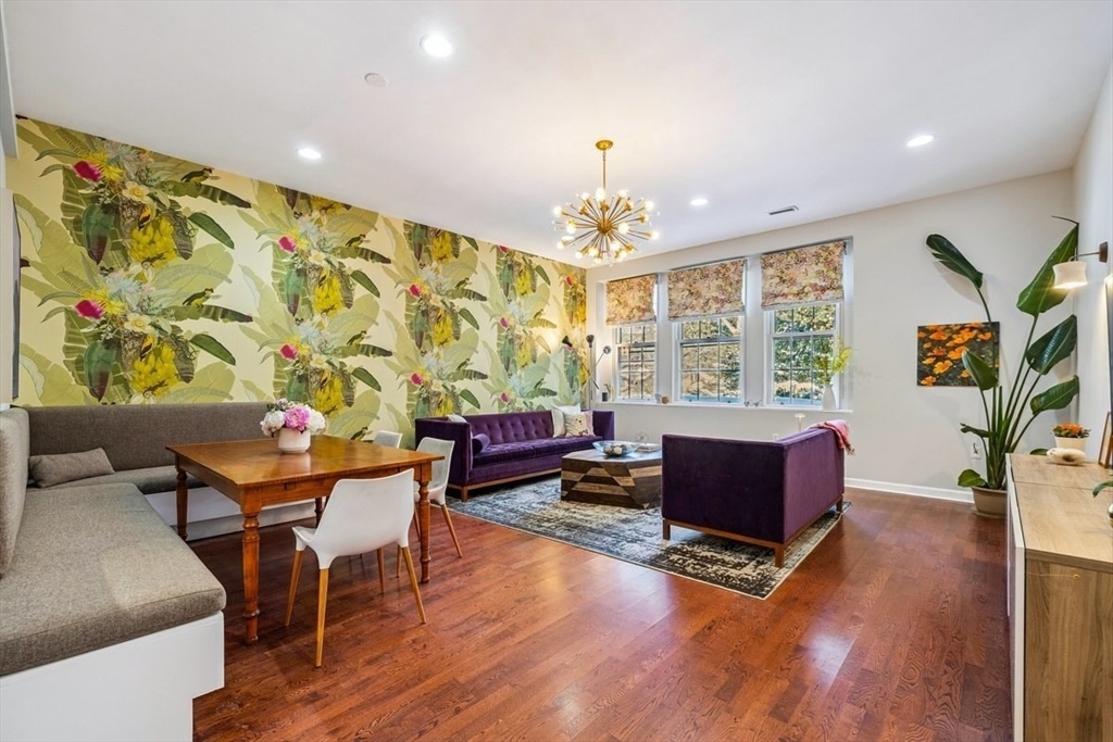 60 Glen Road, Unit 108 Brookline, MA 02445 - Photo 2 of 18 a living room with furniture and a wooden floor