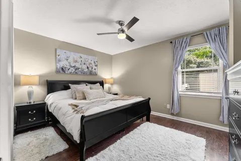 a bedroom with a bed and a walk in closet