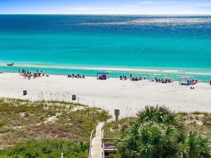 a kitchen with stainless steel appliances a refrigerator stove microwave and cabinets