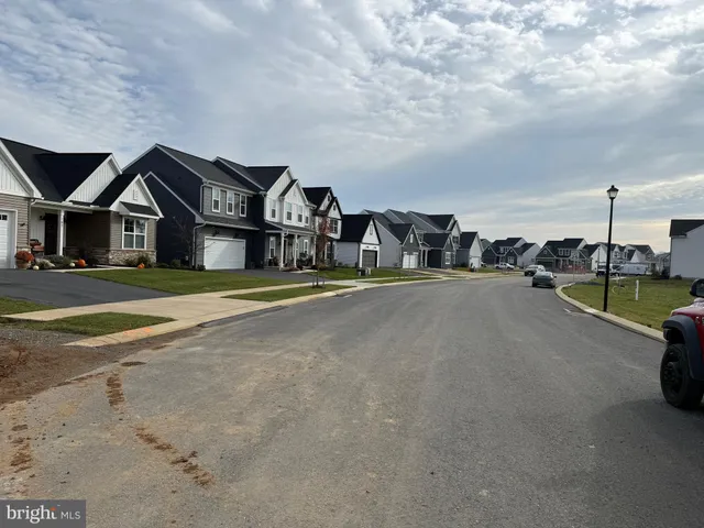 a view of a street with cars