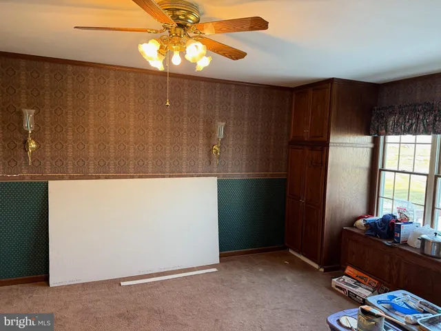 a room with furniture and a window