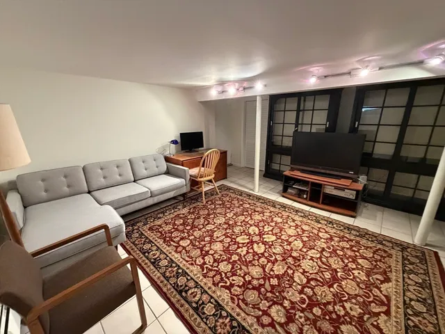a living room with a couch and a flat screen tv