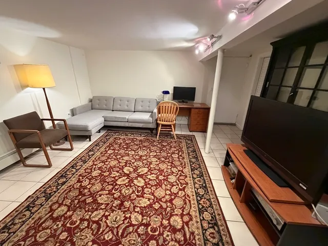 a living room with furniture and a couch