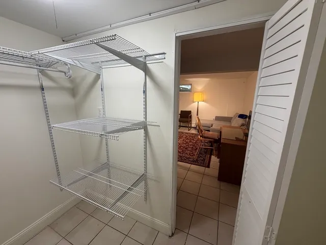 a bathroom with a shower and a sink