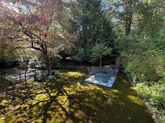 a backyard of a house with lots of green space