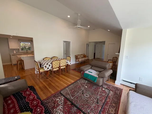 a living room with furniture and a rug