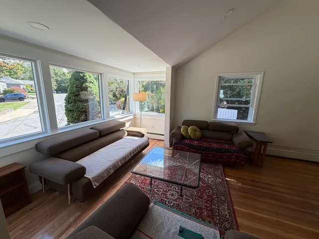 a living room with furniture and a rug