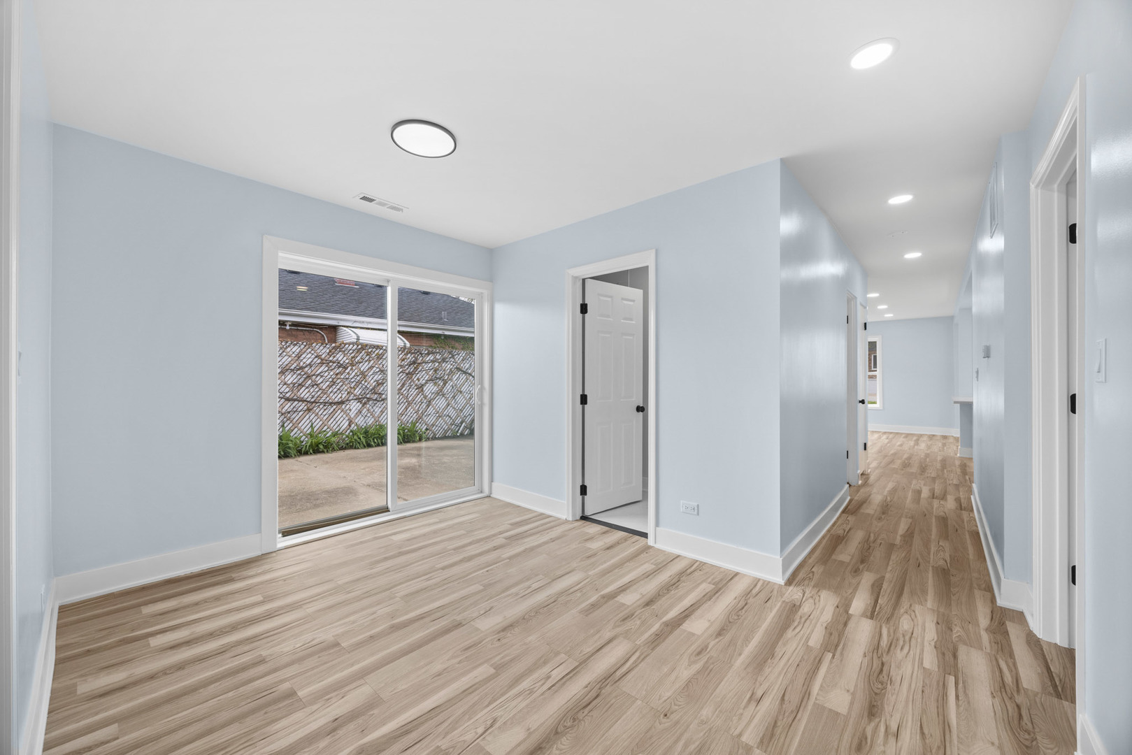 1415 North Taft Avenue Berkeley, IL 60163 - Photo 14 of 24 a view of a room with wooden floor and sliding door